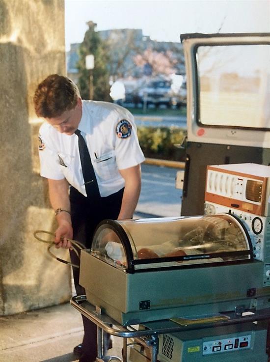 Marochi in 1991, supporting the Infant Transport Team with the transfer of his baby daughter.