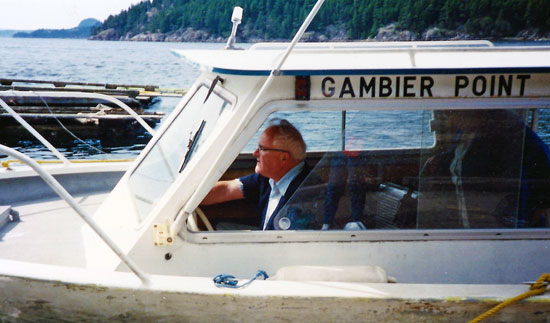 Carson Smith on the boat he used as transport to and from Gambier Island