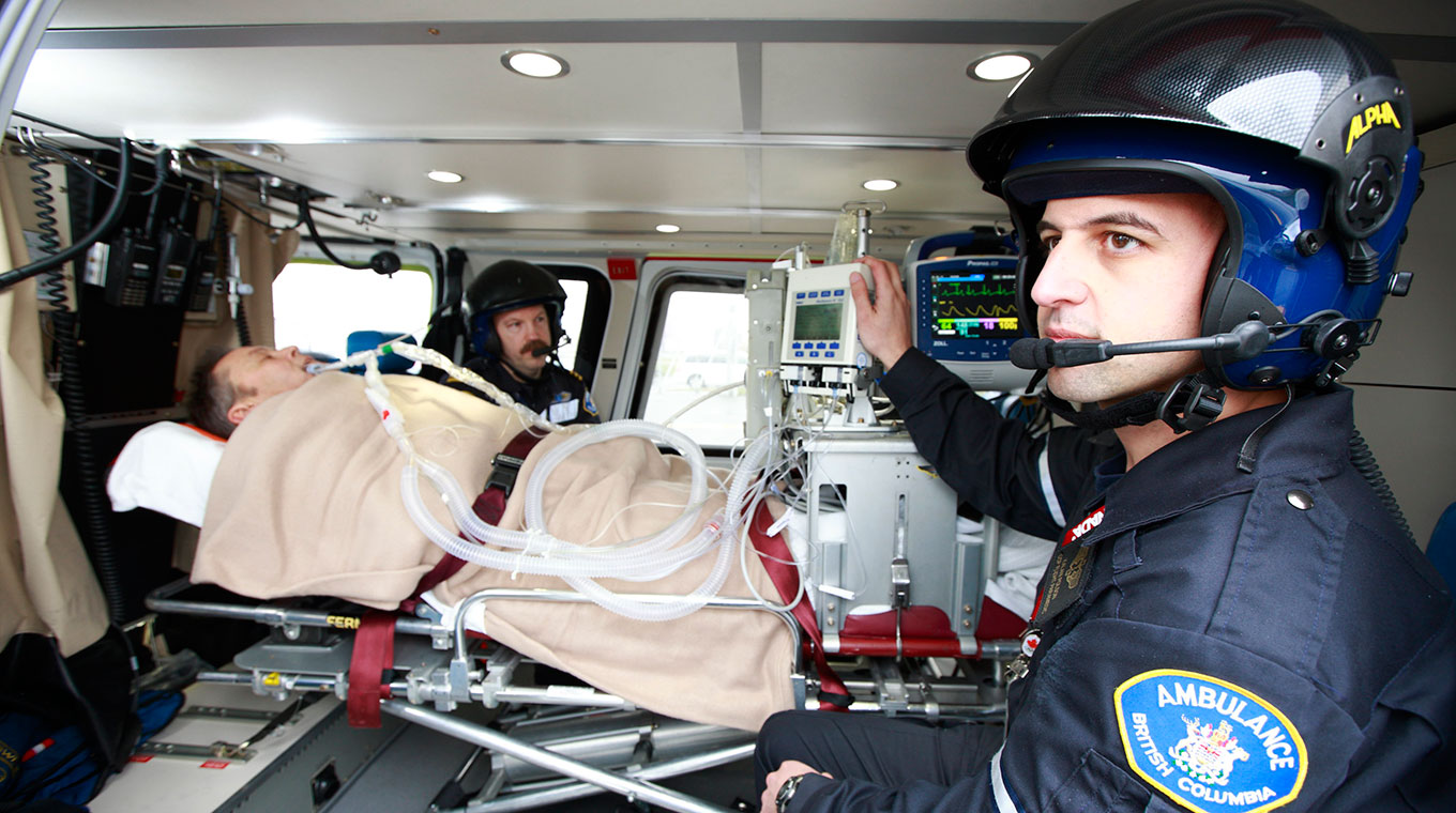 Critical care paramedic transporting a patient