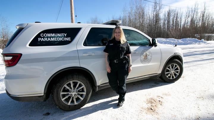 Community Paramedic Lee Cook standing in front of vehicle