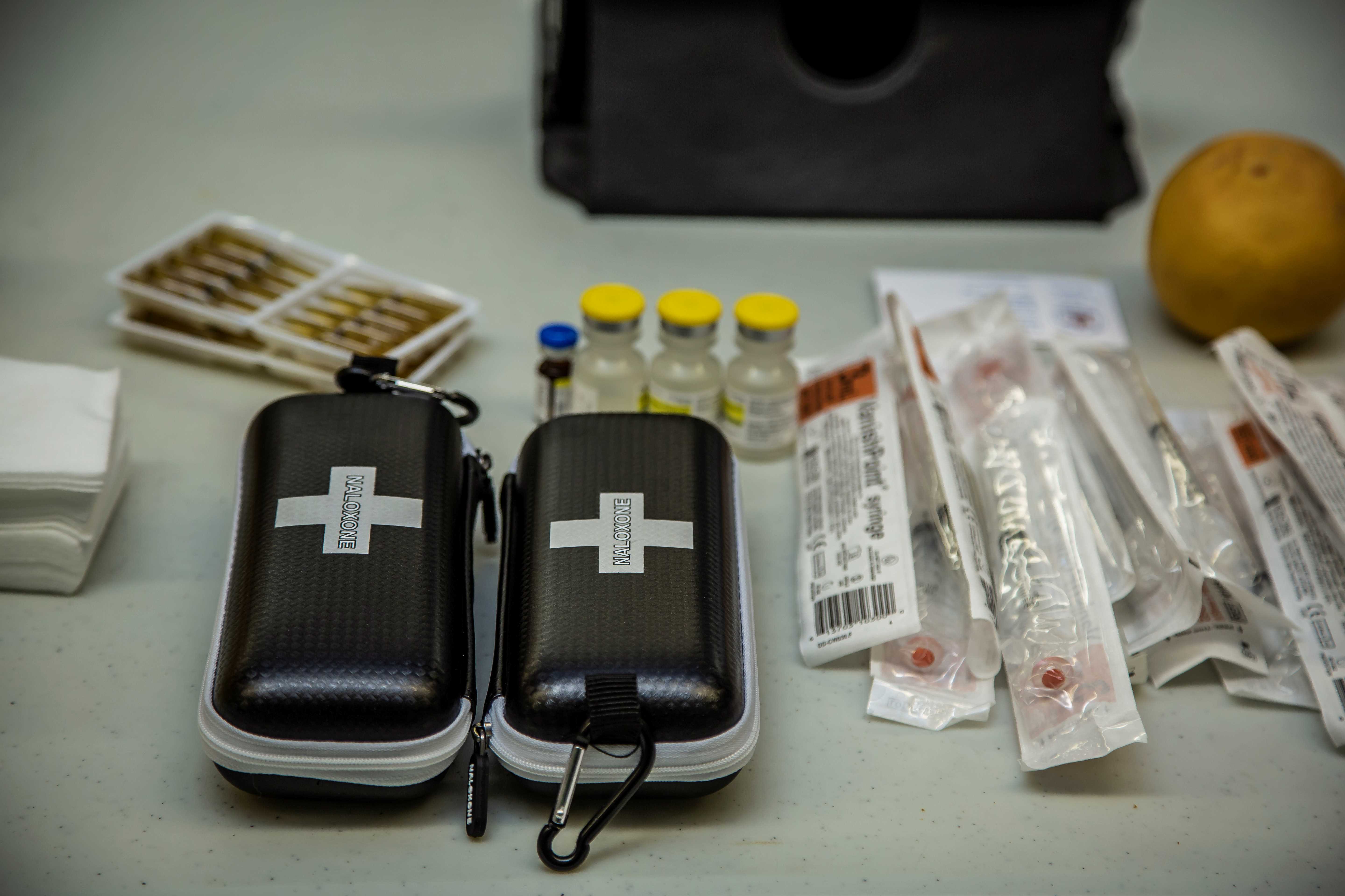 Naloxone kits opened on a table